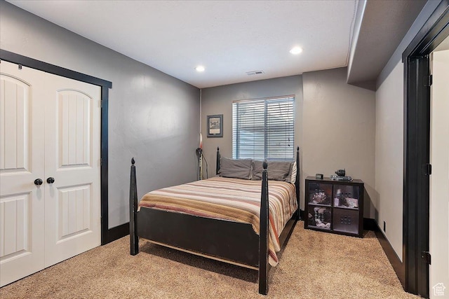 bedroom with light carpet, baseboards, visible vents, and recessed lighting