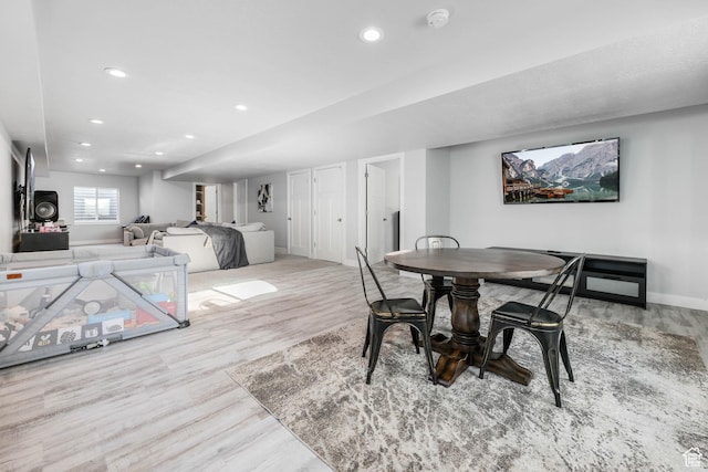 dining room with baseboards, recessed lighting, and wood finished floors