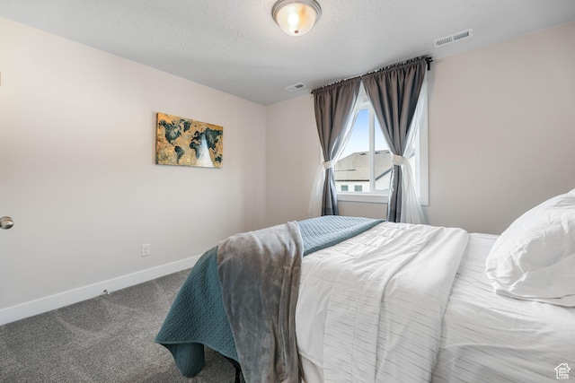 bedroom featuring visible vents, baseboards, and carpet flooring