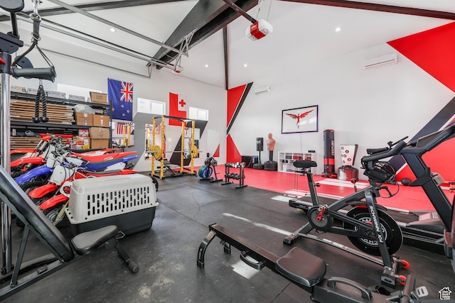 garage featuring an AC wall unit, recessed lighting, and a garage door opener