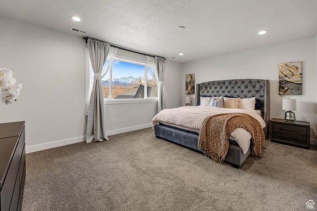 carpeted bedroom featuring recessed lighting, visible vents, and baseboards