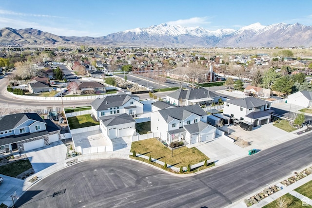 birds eye view of property featuring a mountain view and a residential view