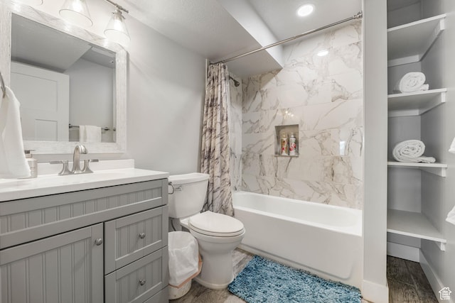 full bath with shower / bathtub combination with curtain, vanity, and toilet