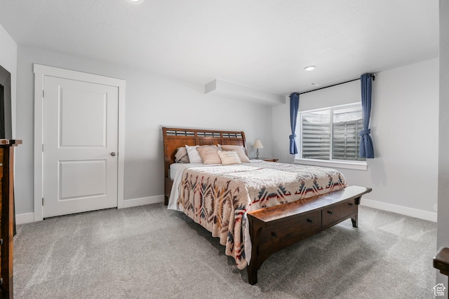 carpeted bedroom with baseboards and recessed lighting