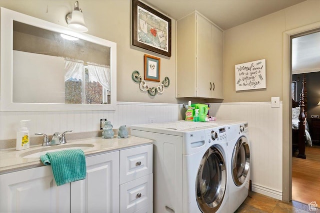 39 S 200 W, Morgan, UT 84050 - laundry room featuring wainscoting, independent washer and dryer, a sink, and cabinet space
