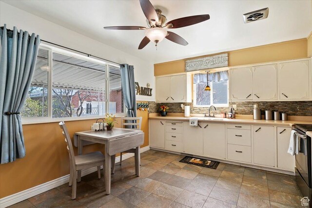 39 S 200 W, Morgan, UT 84050 - kitchen featuring a ceiling fan, a sink, backsplash, and plenty of natural light