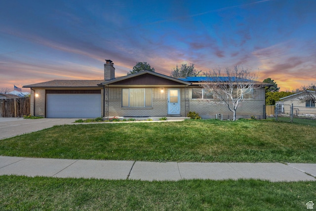 4926 S 3655 W, Taylorsville, UT 84129 - single story home featuring a garage, a yard, brick siding, and fence