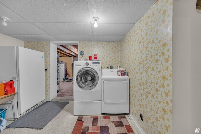 4926 S 3655 W, Taylorsville, UT 84129 - washroom featuring laundry area, wallpapered walls, washing machine and dryer, and tile patterned floors