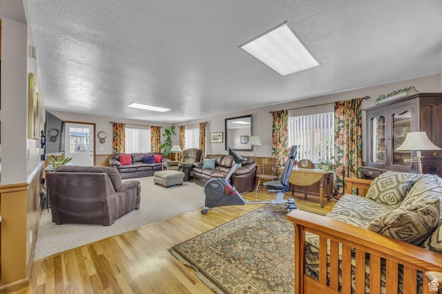 4926 S 3655 W, Taylorsville, UT 84129 - living room with plenty of natural light, a textured ceiling, and wood finished floors
