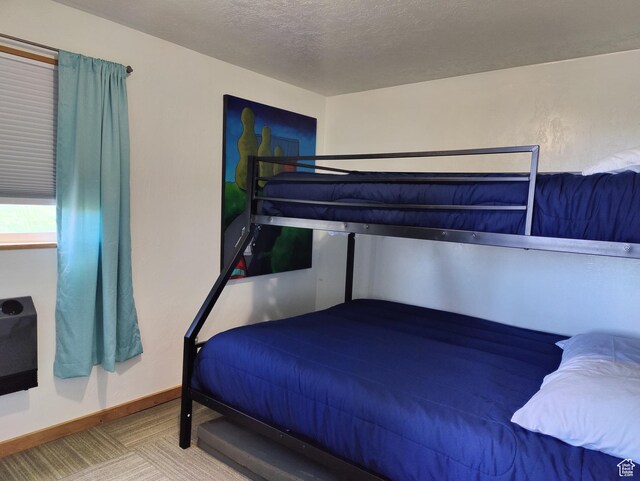 1559 S Bear Lake Blvd S, Garden City, UT 84028 - bedroom with a textured ceiling and baseboards