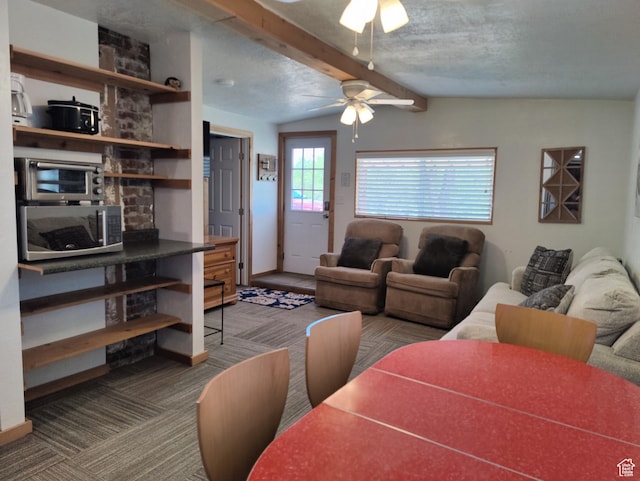 1559 S Bear Lake Blvd S, Garden City, UT 84028 - carpeted living area featuring beam ceiling and a ceiling fan
