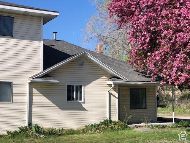 view of home's exterior featuring roof with shingles