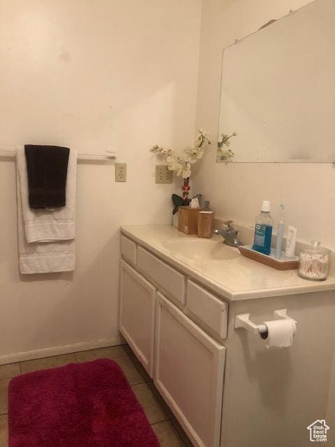 bathroom with vanity and tile patterned flooring