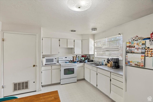 250 N 350 E, Orem, UT 84057 - kitchen with visible vents, white cabinets, a sink, white appliances, and a textured ceiling
