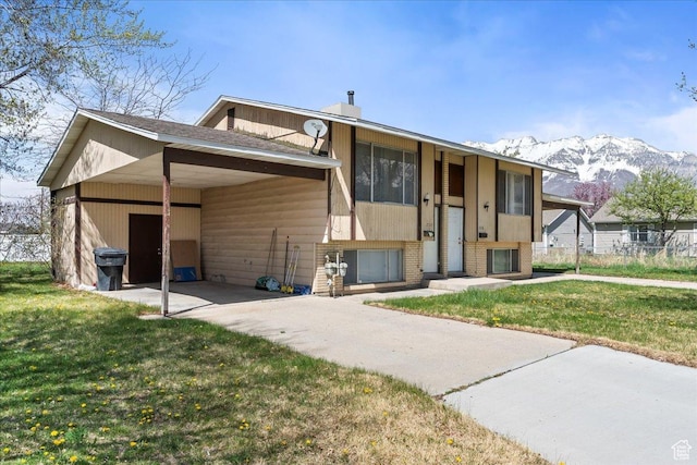 250 N 350 E, Orem, UT 84057 - view of front of house with a front yard, a mountain view, brick siding, and concrete driveway