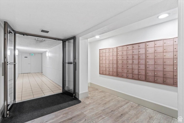 interior space with visible vents and mail area