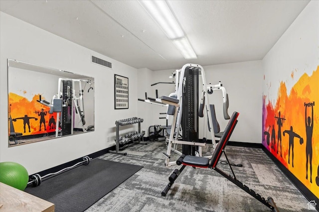 workout area featuring baseboards and visible vents