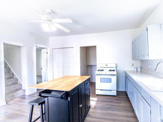 290 W 400 S, Heber City, UT 84032 - kitchen featuring wood finished floors, ceiling fan, a sink, and gas range gas stove