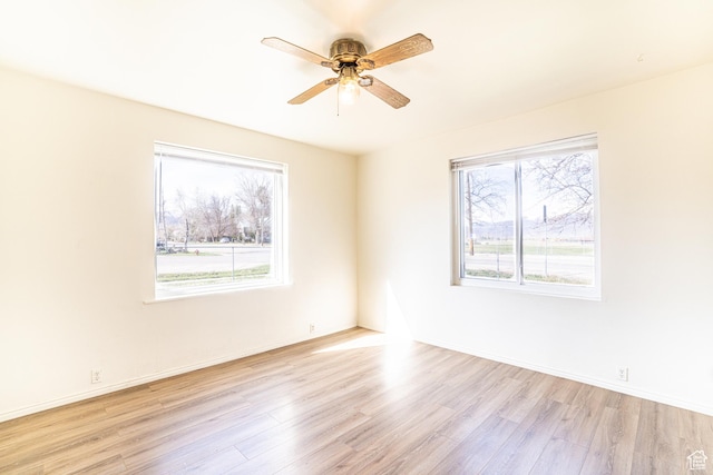 290 W 400 S, Heber City, UT 84032 - unfurnished room with wood finished floors, ceiling fan, and baseboards