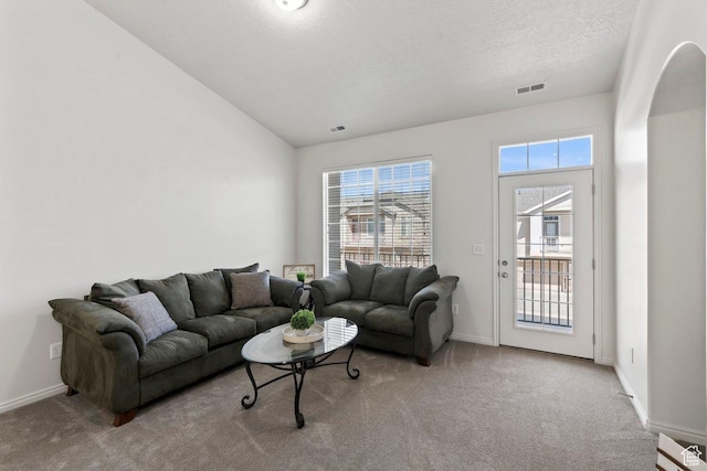 6351 W Traveler Ln, West Jordan, UT 84081 - living room with carpet floors, vaulted ceiling, visible vents, and baseboards