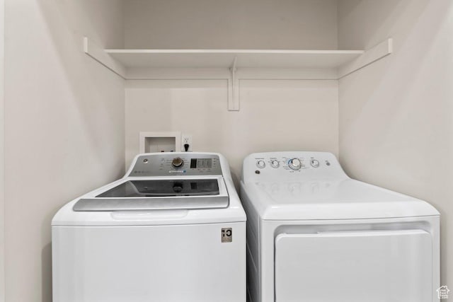 6351 W Traveler Ln, West Jordan, UT 84081 - clothes washing area with independent washer and dryer