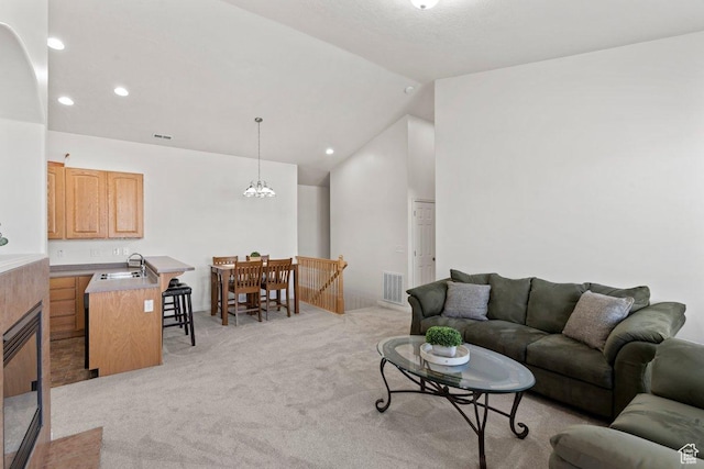 6351 W Traveler Ln, West Jordan, UT 84081 - living area with light carpet, lofted ceiling, visible vents, and recessed lighting