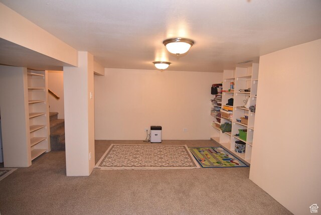 interior space featuring stairway and carpet