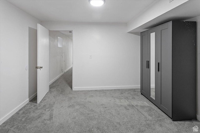 finished basement featuring baseboards and carpet flooring