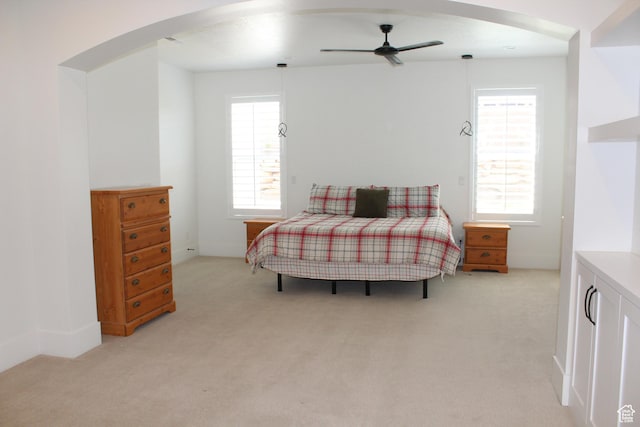 2892 E 1400 S, St George, UT 84790 - bedroom featuring arched walkways, light carpet, and ceiling fan