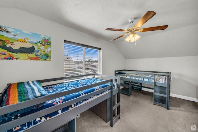 bedroom with lofted ceiling, baseboards, a textured ceiling, ceiling fan, and carpet
