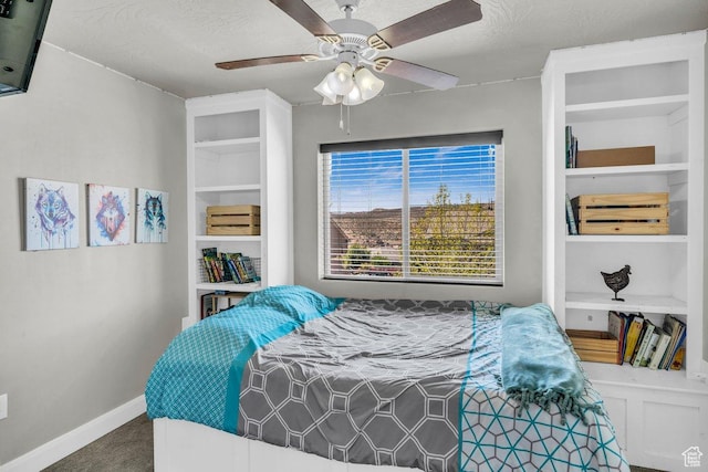 bedroom featuring baseboards, a ceiling fan, and carpet flooring