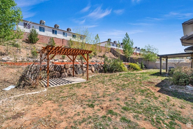 view of yard featuring a pergola, a patio area, and fence