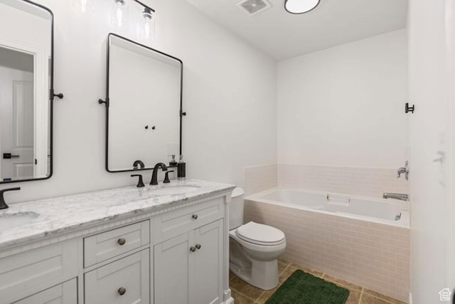 896 W Waterside Dr, Farmington, UT 84025 - bathroom featuring a bath, visible vents, toilet, a sink, and double vanity
