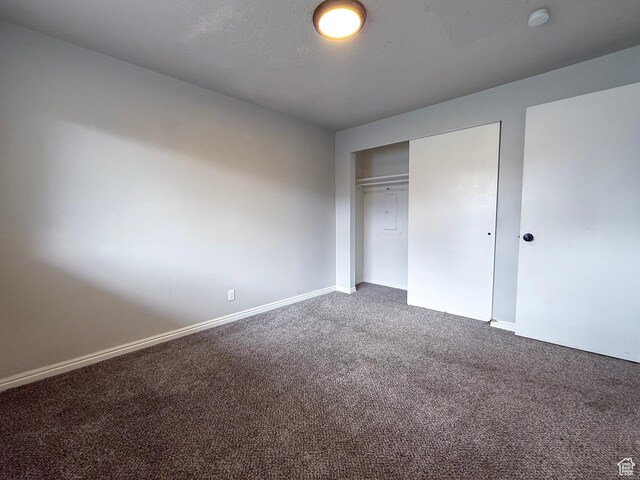 4503 S 2025 W, Roy, UT 84067 - unfurnished bedroom featuring carpet floors, a closet, and baseboards