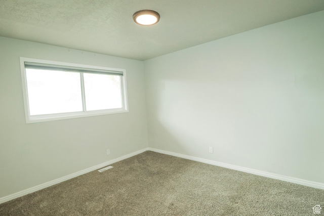 4503 S 2025 W, Roy, UT 84067 - carpeted spare room featuring visible vents and baseboards