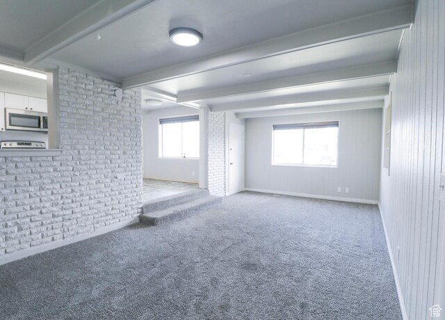 4503 S 2025 W, Roy, UT 84067 - carpeted empty room featuring baseboards and beamed ceiling