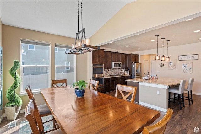 12133 S Broken Arch Ln, Herriman, UT 84096 - dining room featuring visible vents, baseboards, dark wood-style flooring, recessed lighting, and vaulted ceiling