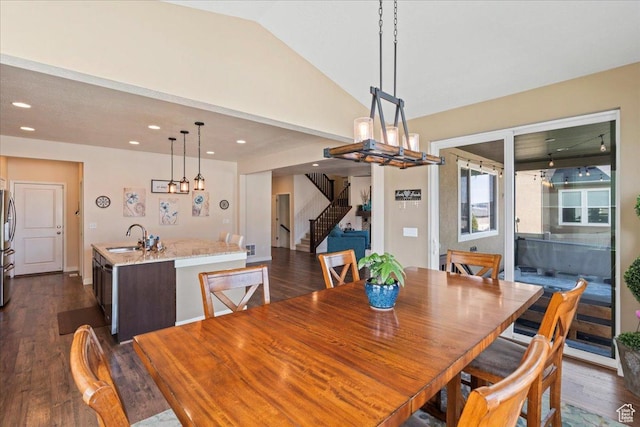 12133 S Broken Arch Ln, Herriman, UT 84096 - dining area featuring recessed lighting, dark wood-style floors, vaulted ceiling, and stairs