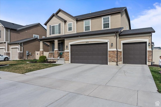12133 S Broken Arch Ln, Herriman, UT 84096 - craftsman house with driveway, stucco siding, stone siding, and an attached garage