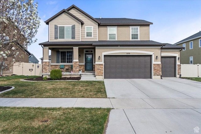 12133 S Broken Arch Ln, Herriman, UT 84096 - craftsman-style house featuring a porch, stucco siding, stone siding, and fence