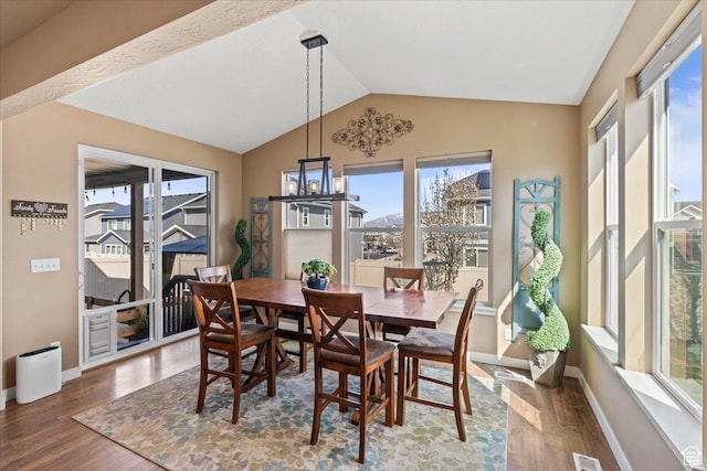 12133 S Broken Arch Ln, Herriman, UT 84096 - dining space featuring a wealth of natural light, wood finished floors, and lofted ceiling