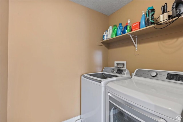 12133 S Broken Arch Ln, Herriman, UT 84096 - clothes washing area featuring independent washer and dryer, laundry area, and a textured ceiling
