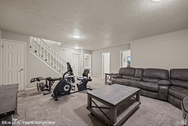 carpeted living room with stairs, a textured ceiling, and baseboards