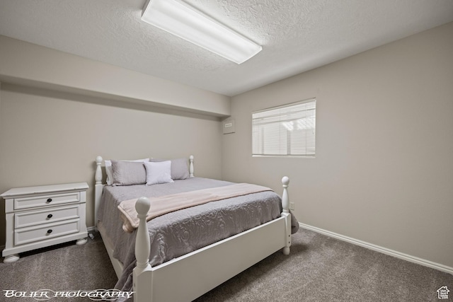 bedroom featuring carpet, a textured ceiling, and baseboards
