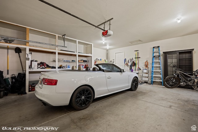 garage featuring a garage door opener