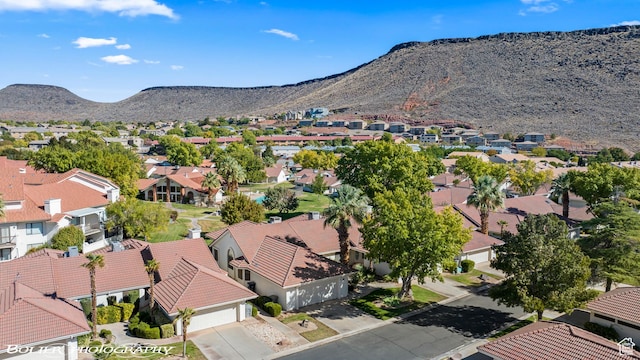 birds eye view of property with a mountain view and a residential view