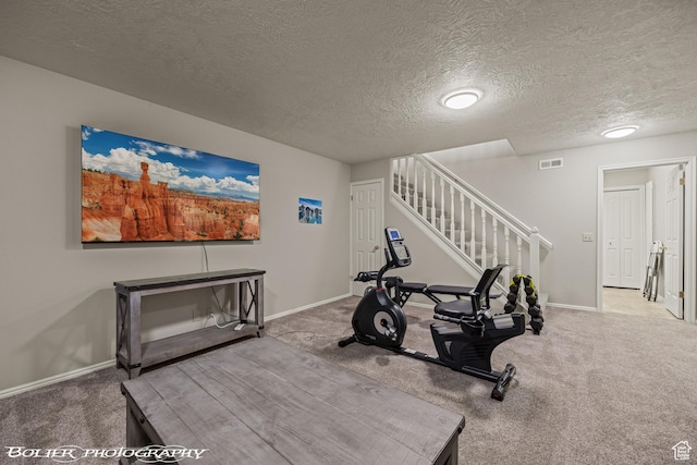 workout area with baseboards and carpet