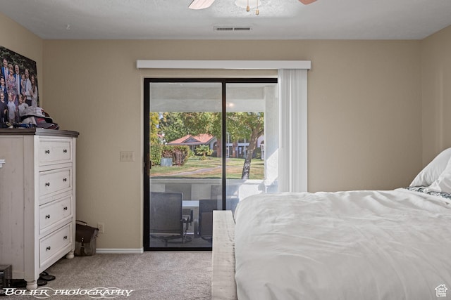 carpeted bedroom with access to exterior, ceiling fan, baseboards, and visible vents