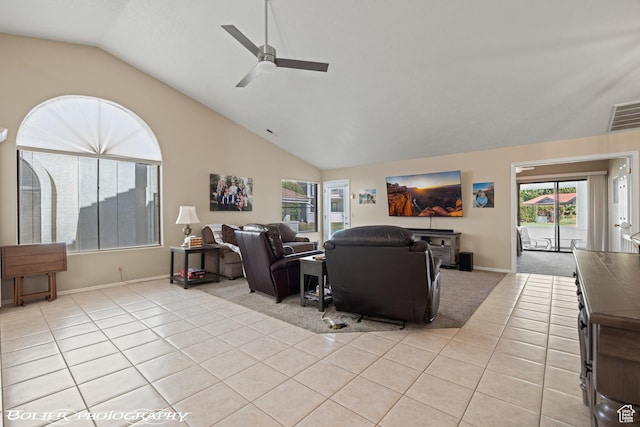 living area with baseboards, vaulted ceiling, light tile patterned floors, a ceiling fan, and visible vents