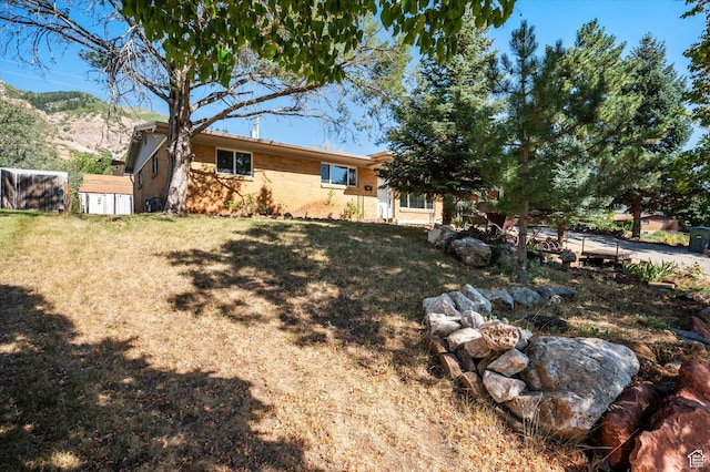 940 Fillmore Ave, Ogden, UT 84404 - view of yard featuring a storage unit
